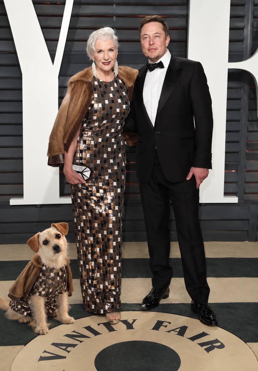 Cali in a matching outfit on a red carpet